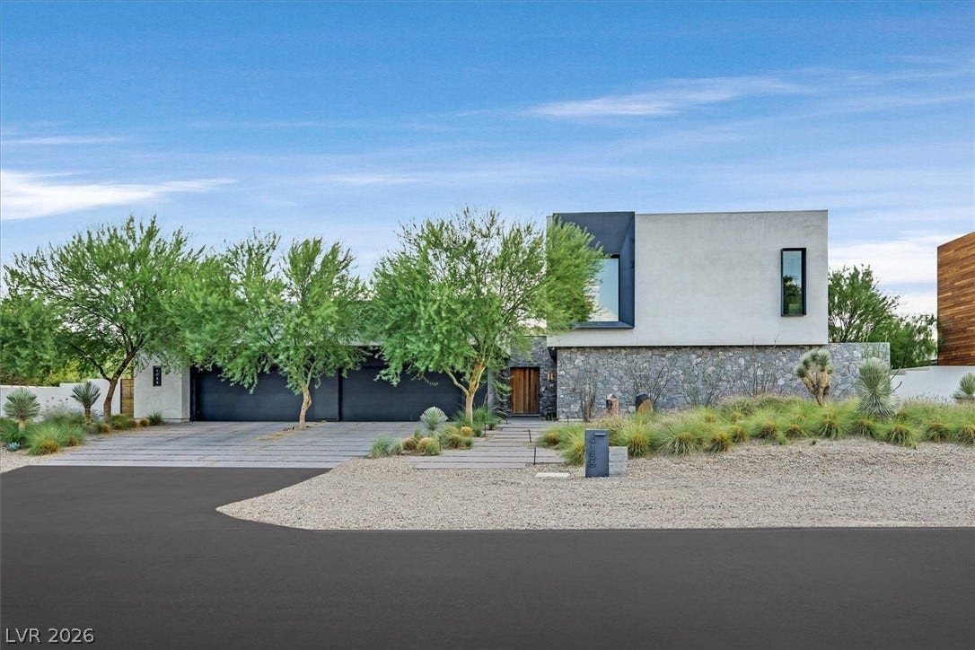 4155 Badura Avenue, Las Vegas, NV 89118 Striking contemporary design blends smooth stucco, natural stone, and bold architectural lines under clear desert skies.