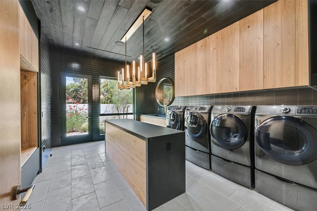 4155 Badura Avenue, Las Vegas, NV 89118 Rich wood plank ceilings and modern tiled walls elevate this highly functional utility space.