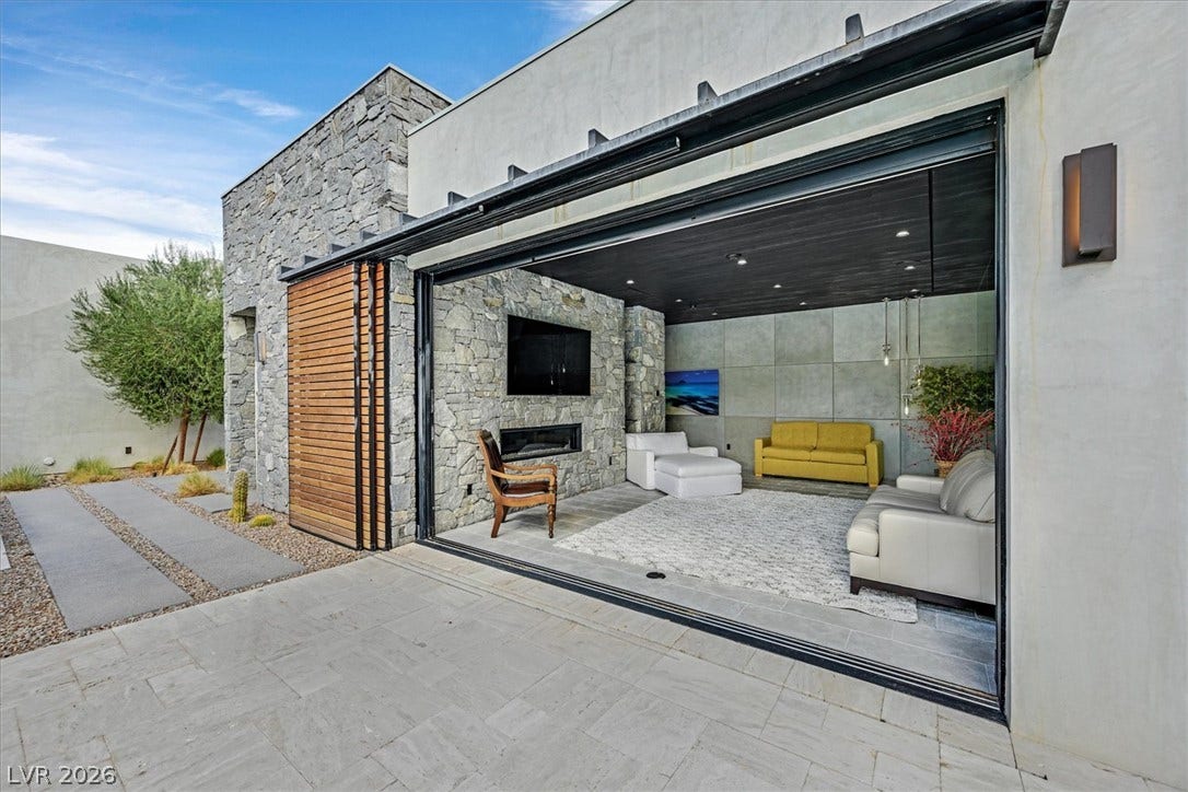 4155 Badura Avenue, Las Vegas, NV 89118 Massive pocket doors blur the line between indoor comfort and outdoor lounging.
