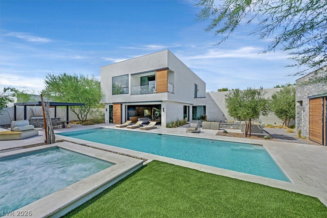 4155 Badura Avenue, Las Vegas, NV 89118 An architectural masterpiece opens seamlessly to an oasis featuring a pool and spa.