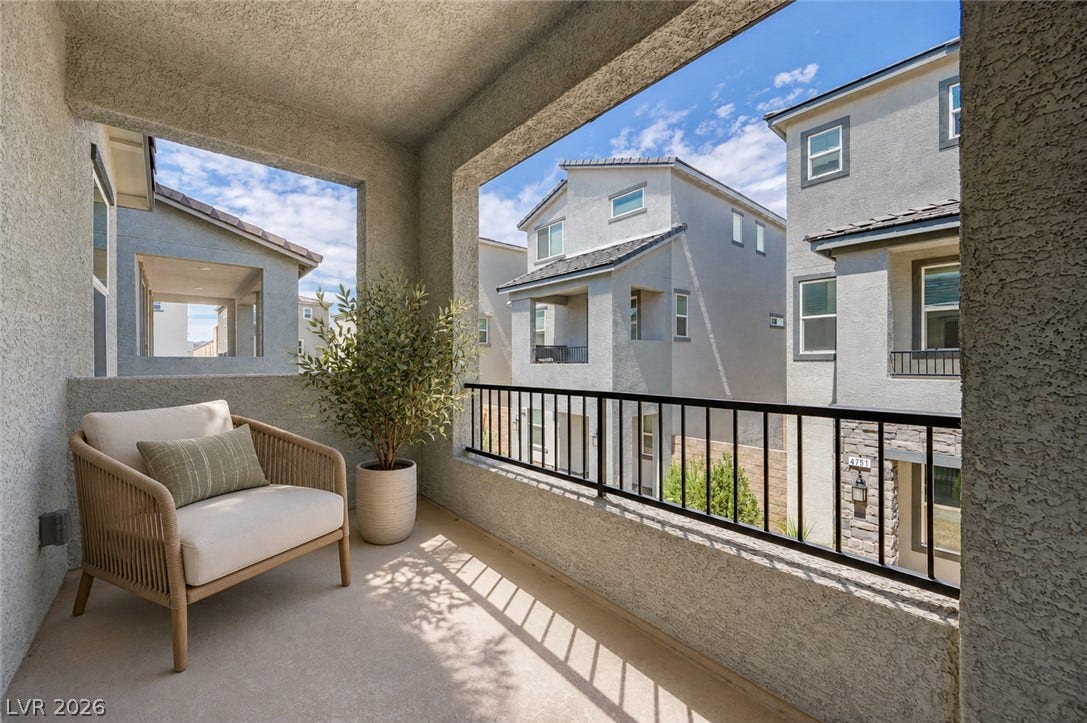An elevated covered balcony overlooks the surrounding neighborhood.