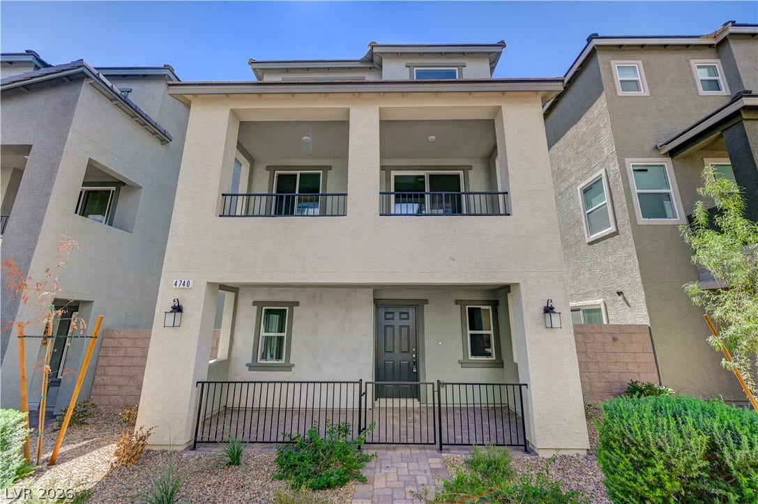 Multi-level modern architecture highlights this exterior featuring structured balconies and paved entryways.