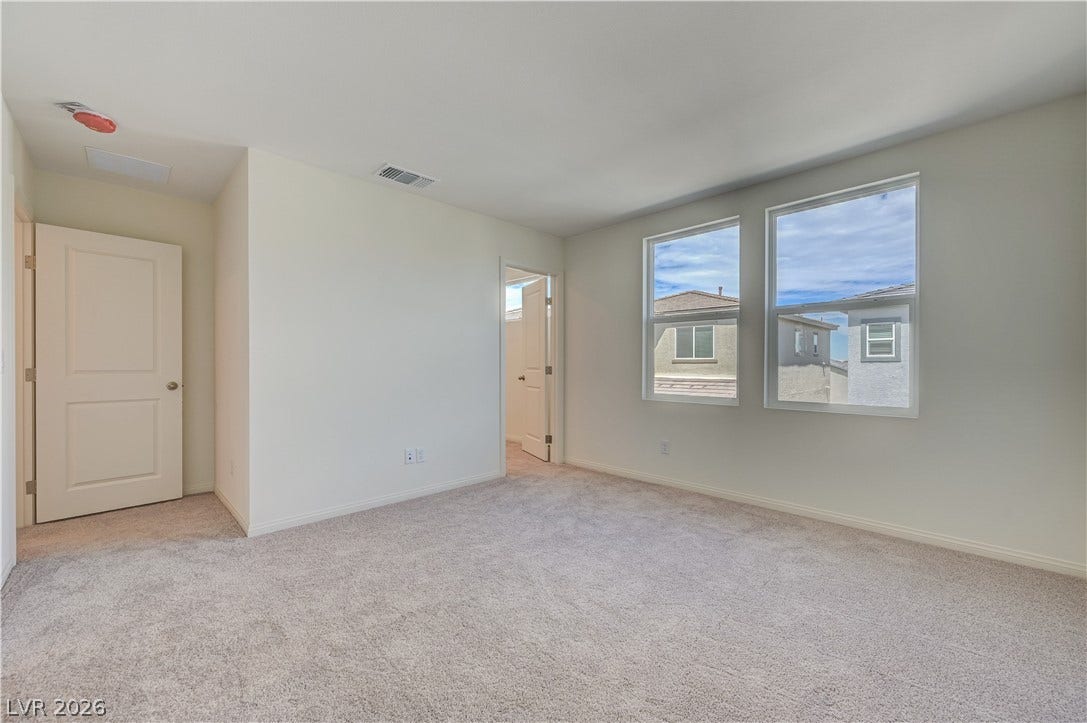 Plush carpeting and natural light define this versatile upper-level space.