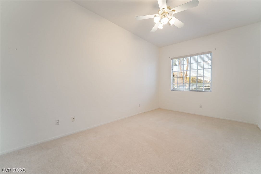 2722 Bass Lake Street, Henderson, NV 89052 Soft carpeting pairs with a multi-pane window to create a serene bedroom setting.