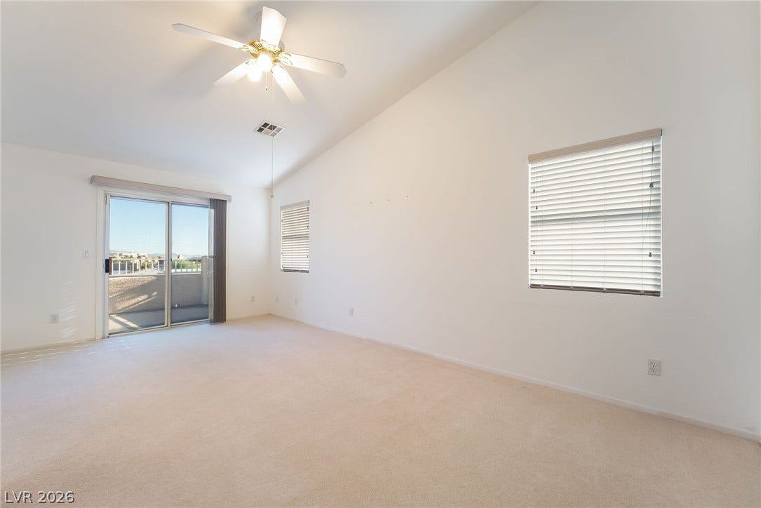 2722 Bass Lake Street, Henderson, NV 89052 Plush carpeting and vaulted ceilings define this airy living space with private patio access.