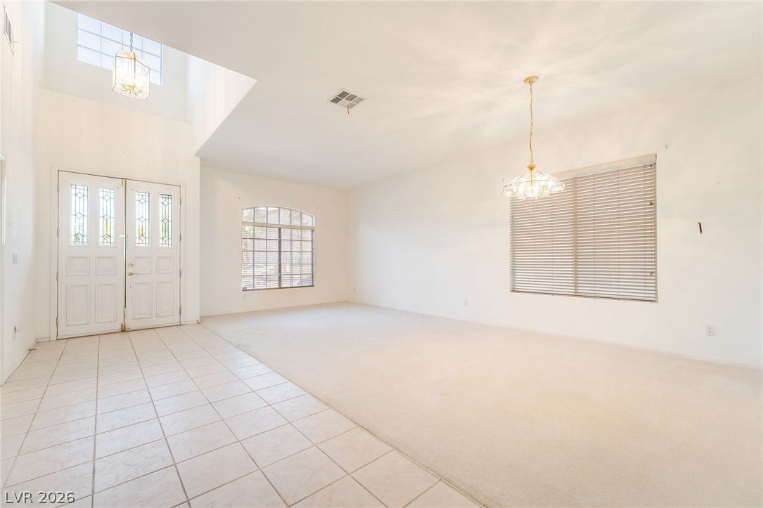 2722 Bass Lake Street, Henderson, NV 89052 Gleaming tile floors transition seamlessly into comfortable living spaces beneath towering high ceilings.