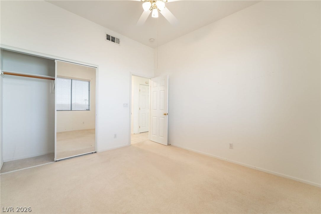 2722 Bass Lake Street, Henderson, NV 89052 A spacious bedroom with high ceilings and neutral wall finishes.