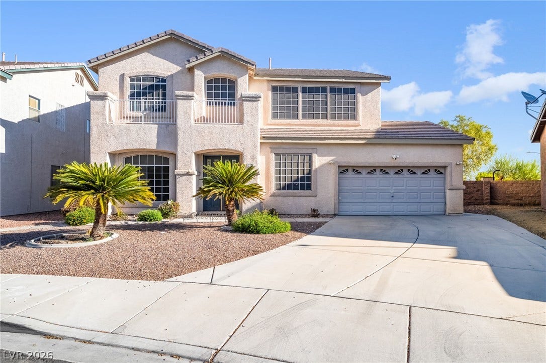 2722 Bass Lake Street, Henderson, NV 89052 Symmetrical stucco design and low-maintenance desert landscaping define this two-story exterior facade.