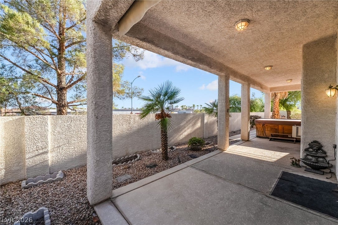 2722 Bass Lake Street, Henderson, NV 89052 An inviting covered patio features smooth concrete flooring and overlooks a private walled yard.