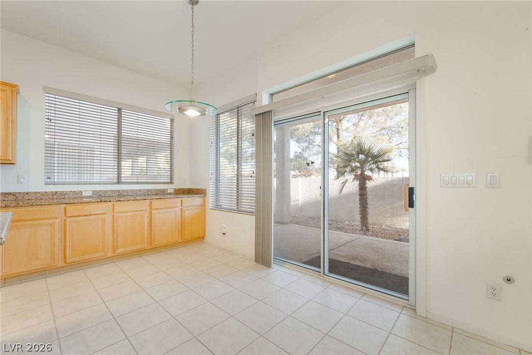 2722 Bass Lake Street, Henderson, NV 89052 Tiled flooring and sliding glass doors create a seamless connection to the outdoor patio.