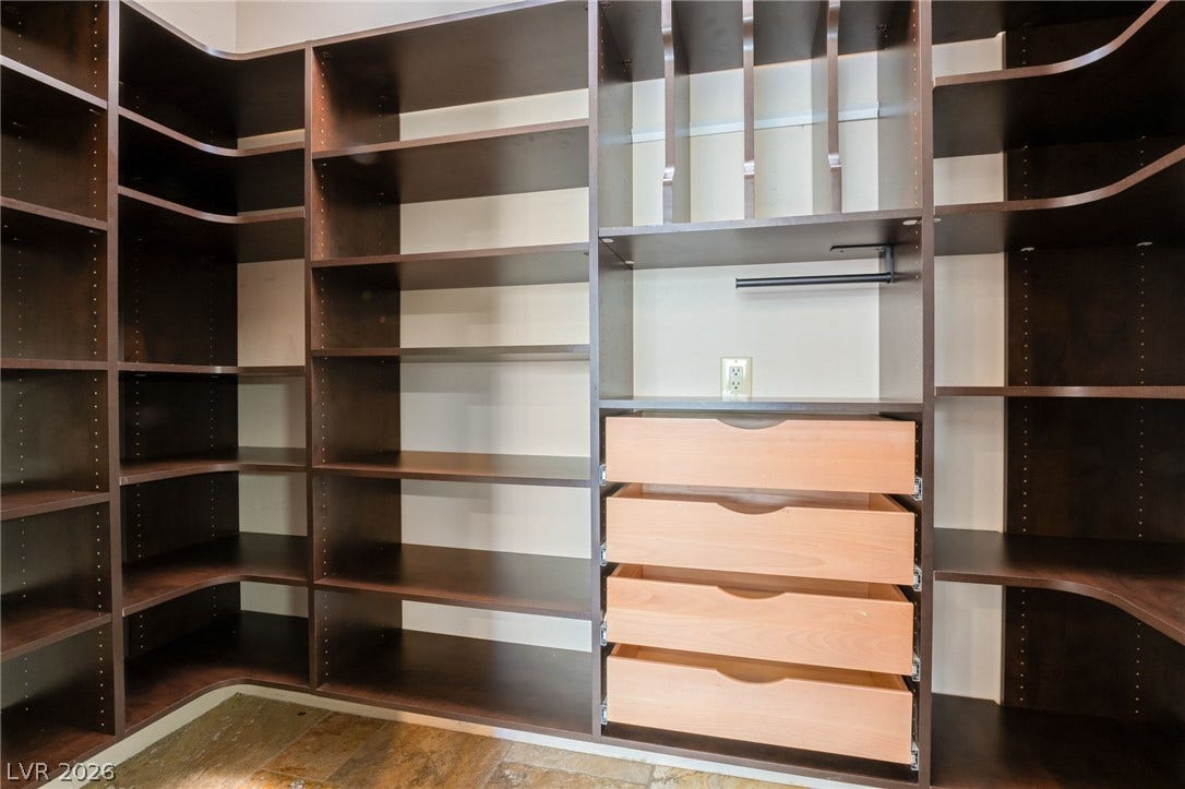 7154 Ranchito Circle, Las Vegas, NV 89120 Custom built-in shelving and integrated drawers maximize storage efficiency in this spacious closet.