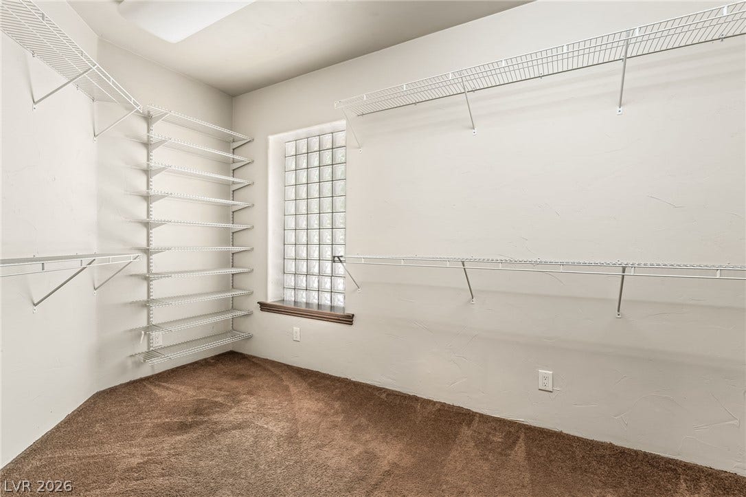 7154 Ranchito Circle, Las Vegas, NV 89120 Ample wire shelving and cozy carpeting define this functional walk-in closet space.