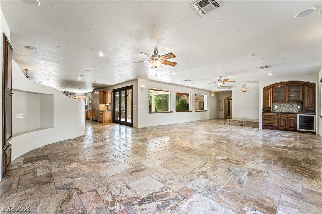 7154 Ranchito Circle, Las Vegas, NV 89120 An open floorplan flows seamlessly across tile flooring under recessed lighting.