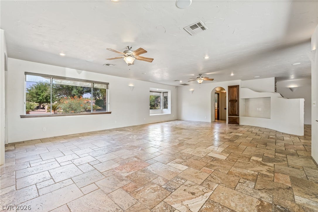 7154 Ranchito Circle, Las Vegas, NV 89120 Textured tile flooring runs throughout this generous living space lined with picture windows.