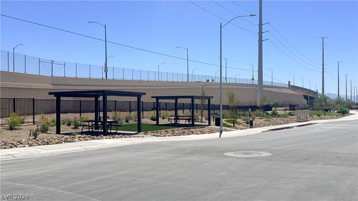 4240 Mount Bonnell Avenue, North Las Vegas, NV 89081 Sheltered picnic tables stand adjacent to landscaped community spaces and paved streets.