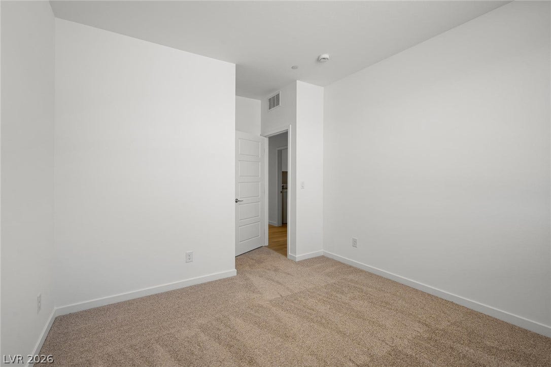 1670 Capri Falls Court, Henderson, NV 89011 Soft carpeting underfoot provides comfort in this quiet and versatile interior room.