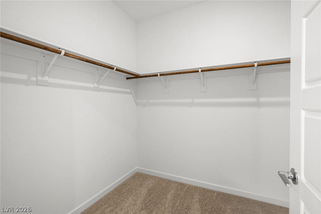 1670 Capri Falls Court, Henderson, NV 89011 An organized closet provides built-in shelving, hanging rods, and soft carpeting.