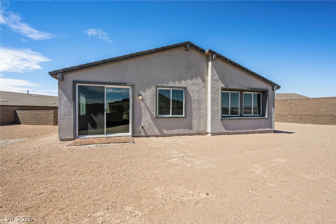 1670 Capri Falls Court, Henderson, NV 89011 A stucco exterior with clean lines sits under a classic tiled roofline.