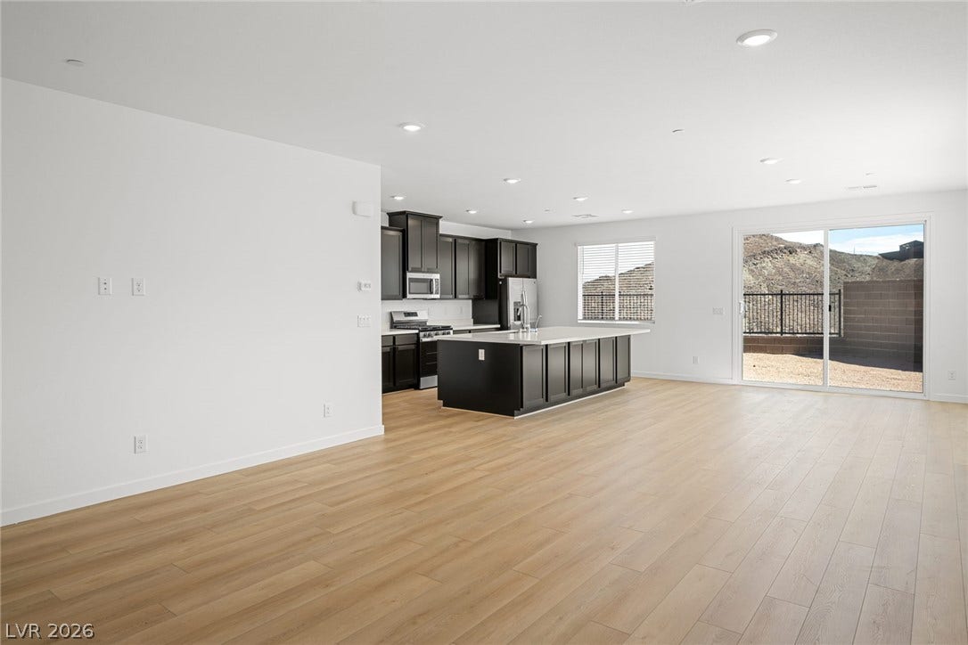 1670 Capri Falls Court, Henderson, NV 89011 An open concept design seamlessly connects the modern kitchen with the spacious main living area.