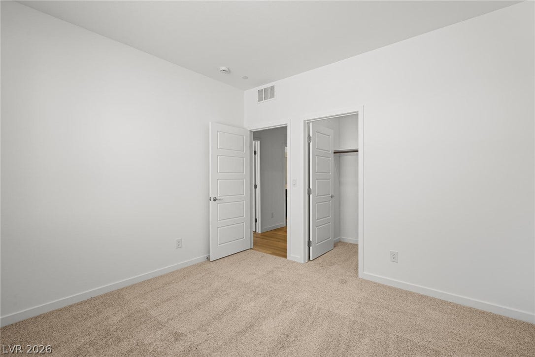 1670 Capri Falls Court, Henderson, NV 89011 Soft carpeting underfoot complements this versatile room featuring a walk-in closet.