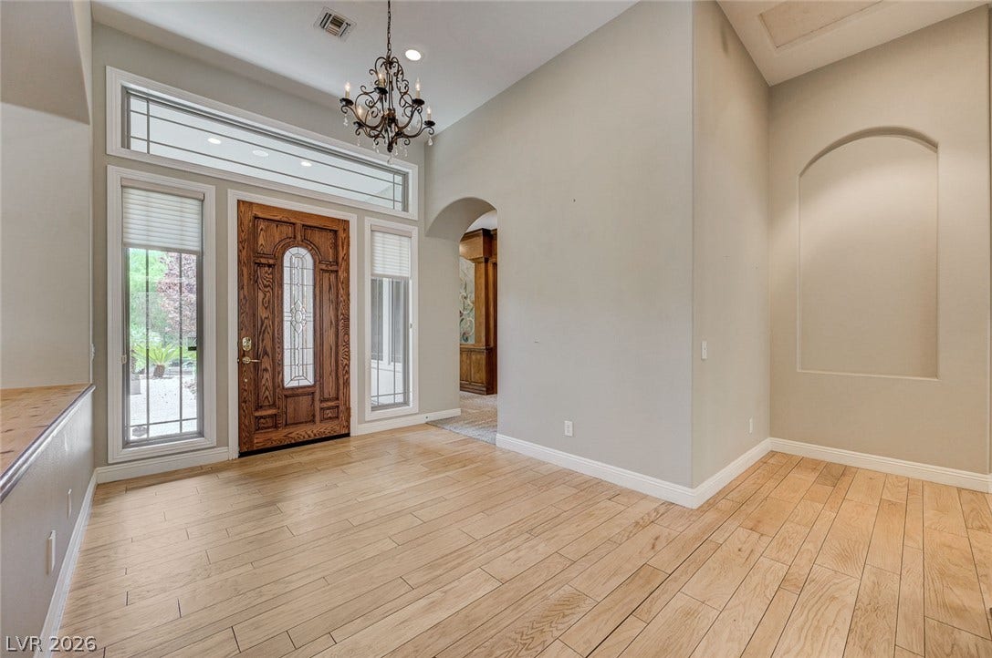 8 Starbrook Drive, Henderson, NV 89052 Gleaming hardwood floors and a soaring ceiling define this welcoming entry space.