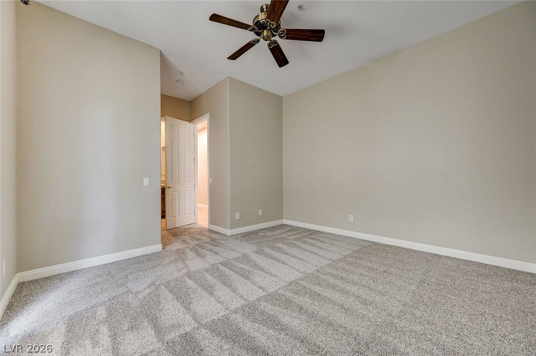 8 Starbrook Drive, Henderson, NV 89052 High ceilings and soft carpeting create a comfortable, inviting ambiance in this versatile bedroom.