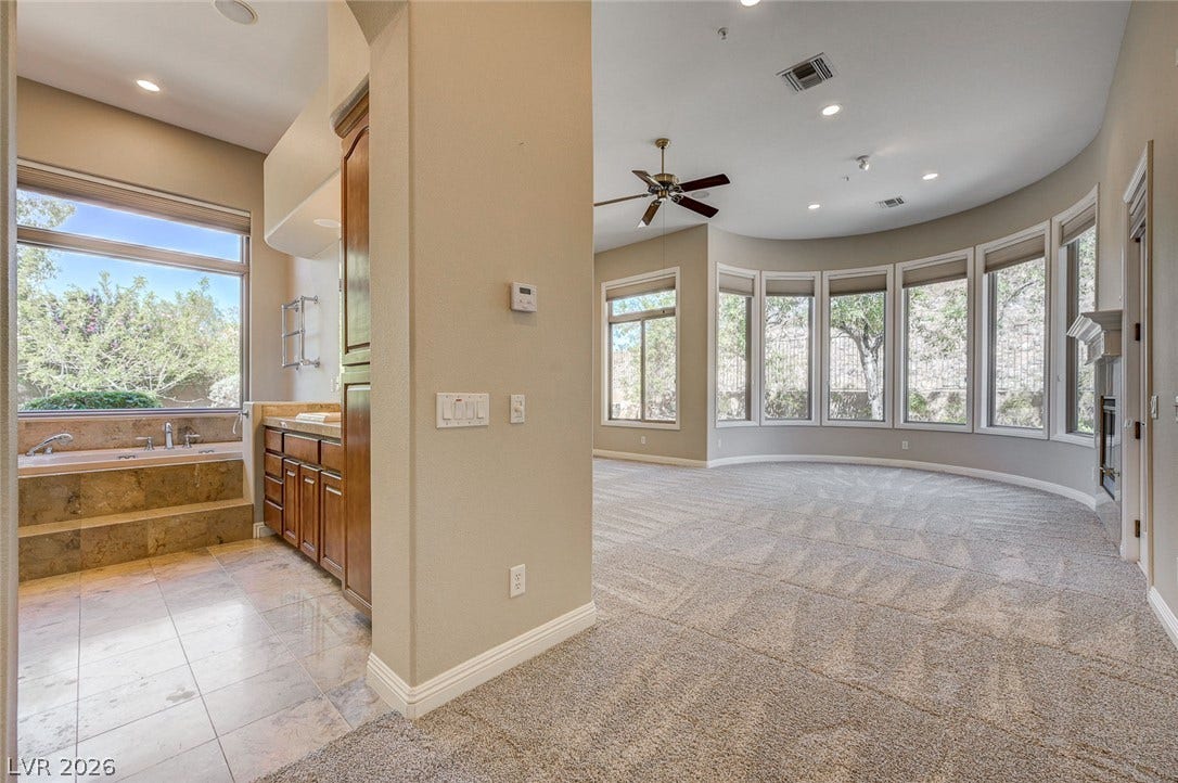 8 Starbrook Drive, Henderson, NV 89052 A curved wall of windows illuminates the spacious bedroom suite adjacent to the bath.