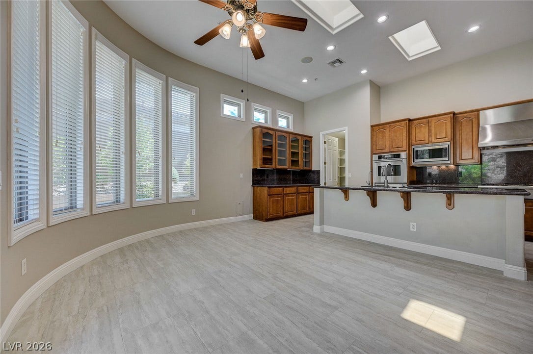 8 Starbrook Drive, Henderson, NV 89052 High ceilings with skylights elevate this open dining area adjacent to the kitchen.