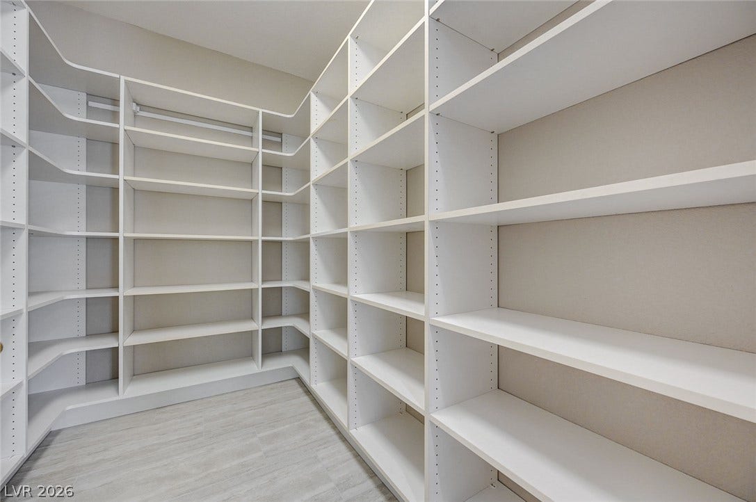 8 Starbrook Drive, Henderson, NV 89052 Abundant built-in shelving lines this spacious walk-in storage area with clean lines.