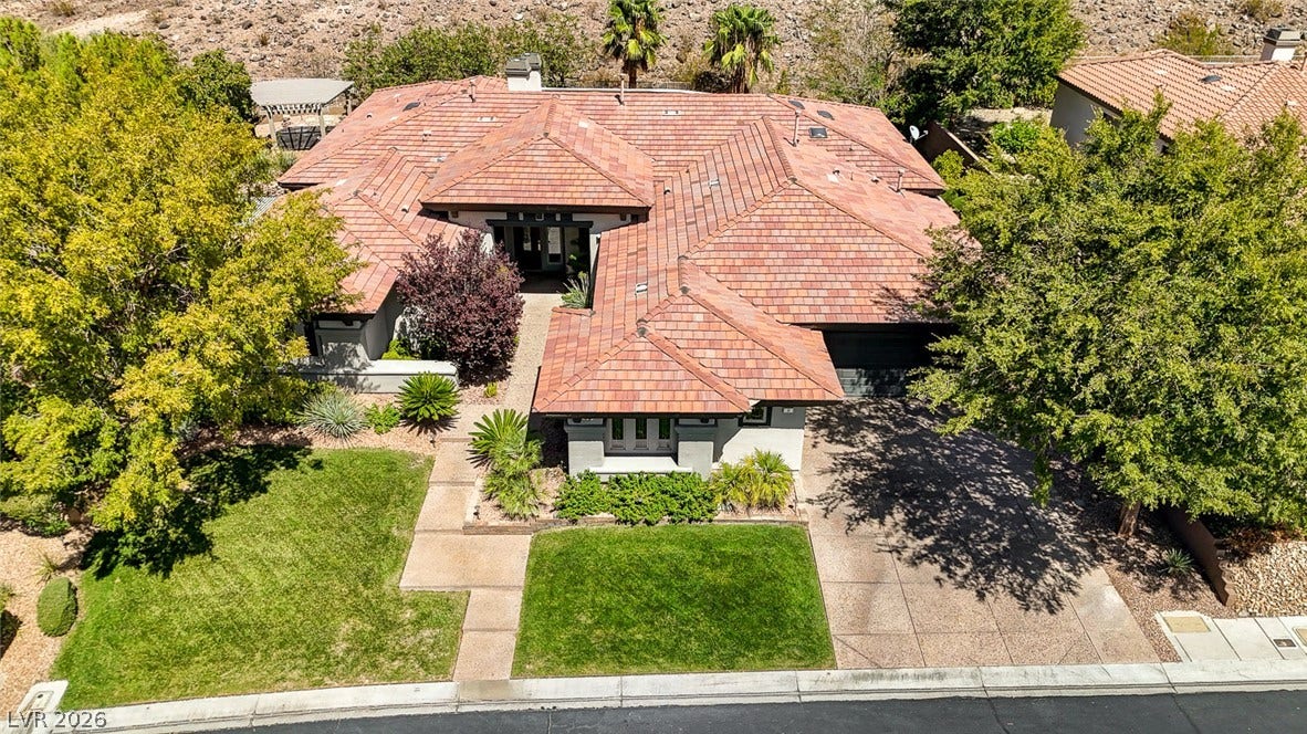 8 Starbrook Drive, Henderson, NV 89052 An aerial perspective reveals the classic tile roofline and sprawling layout of this elegant estate.