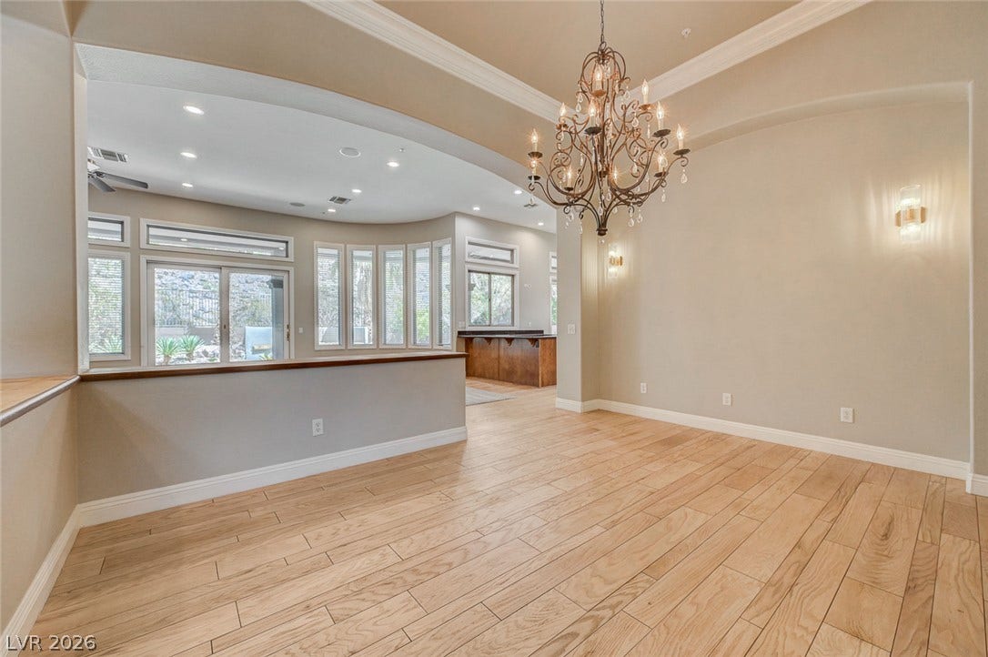 8 Starbrook Drive, Henderson, NV 89052 Elegant wood floors and a classic light fixture define this open dining space.