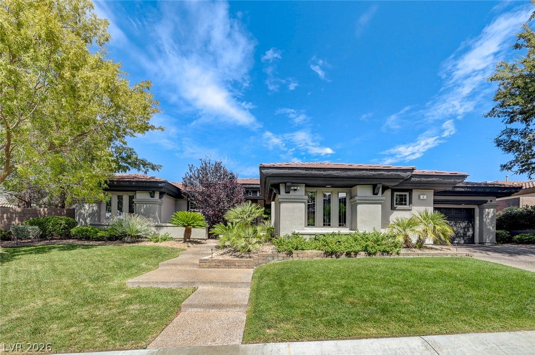 8 Starbrook Drive, Henderson, NV 89052 Manicured lawns and custom stone steps lead toward this striking contemporary architectural facade.