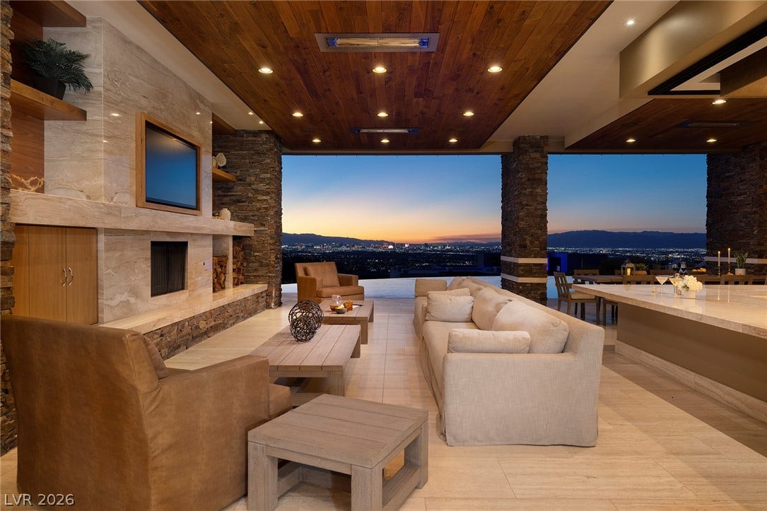 761 Dragon Ridge Drive, Henderson, NV 89012 An open-concept living pavilion reveals sweeping city light views framing the horizon.