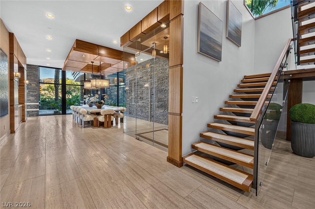 761 Dragon Ridge Drive, Henderson, NV 89012 Clean lines and a modern floating staircase define this welcoming entrance foyer.