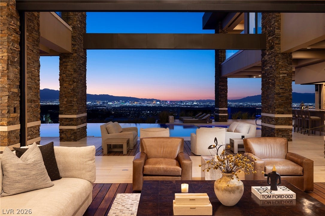 761 Dragon Ridge Drive, Henderson, NV 89012 Stunning city skyline vistas frame this indoor outdoor living space through massive glass openings.