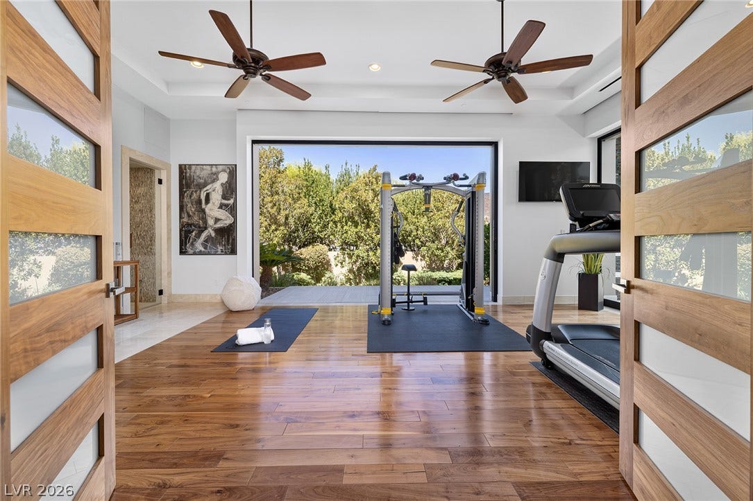 761 Dragon Ridge Drive, Henderson, NV 89012 Rich hardwood floors and soaring ceilings create an airy atmosphere for workouts.