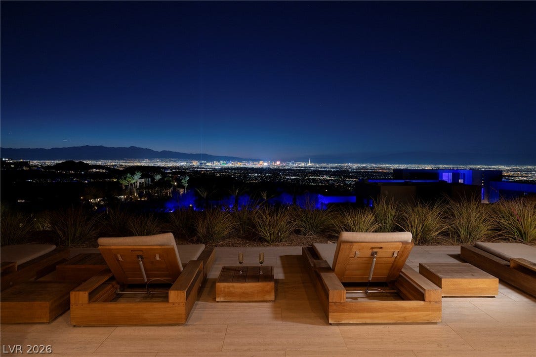 761 Dragon Ridge Drive, Henderson, NV 89012 Glittering city lights shine across the horizon from this elevated stone terrace.