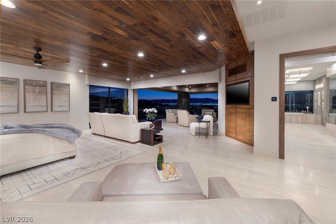 761 Dragon Ridge Drive, Henderson, NV 89012 Gleaming tile floors and a rich wood ceiling define this expansive primary suite.