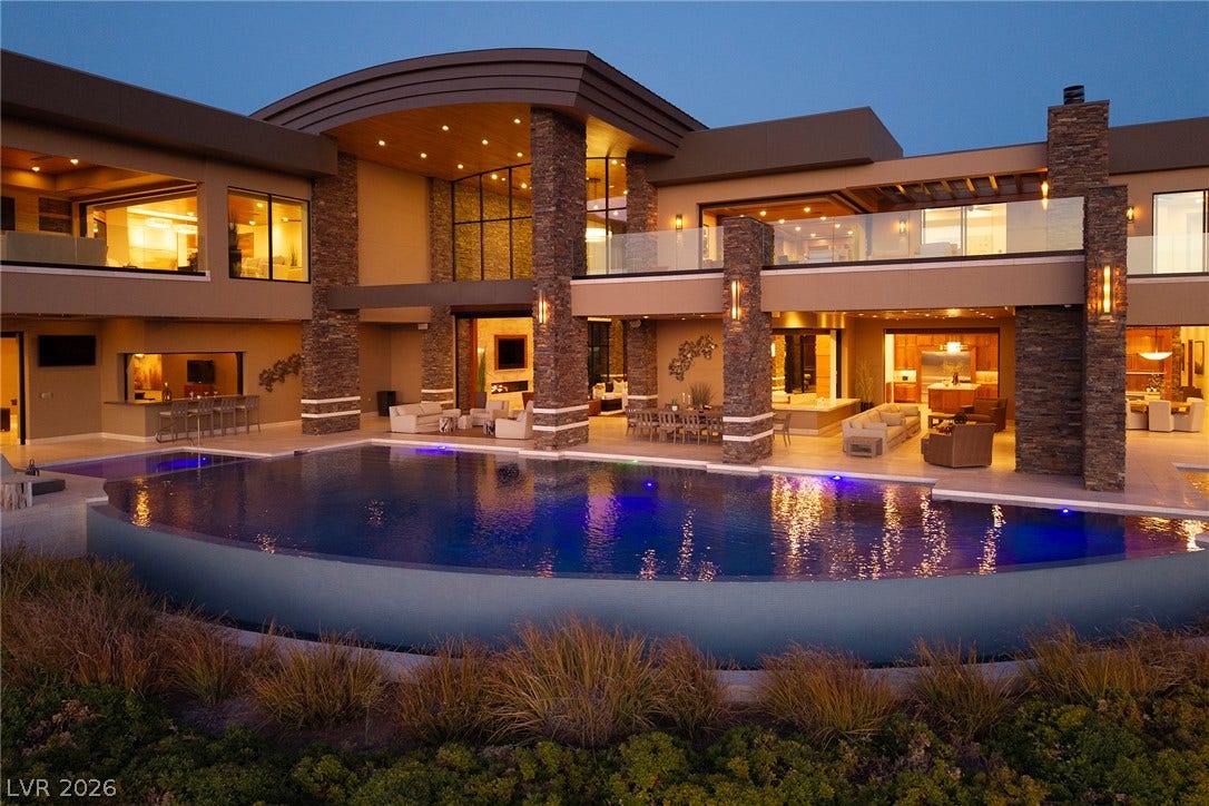 761 Dragon Ridge Drive, Henderson, NV 89012 Dramatic stone pillars frame an incredible outdoor living space overlooking a pristine infinity pool.
