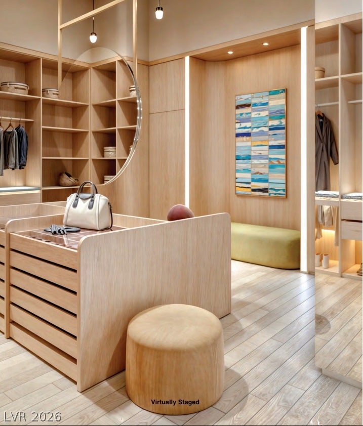 "Virtually Staged" Custom wood cabinetry and light-toned flooring define this spacious dressing suite.