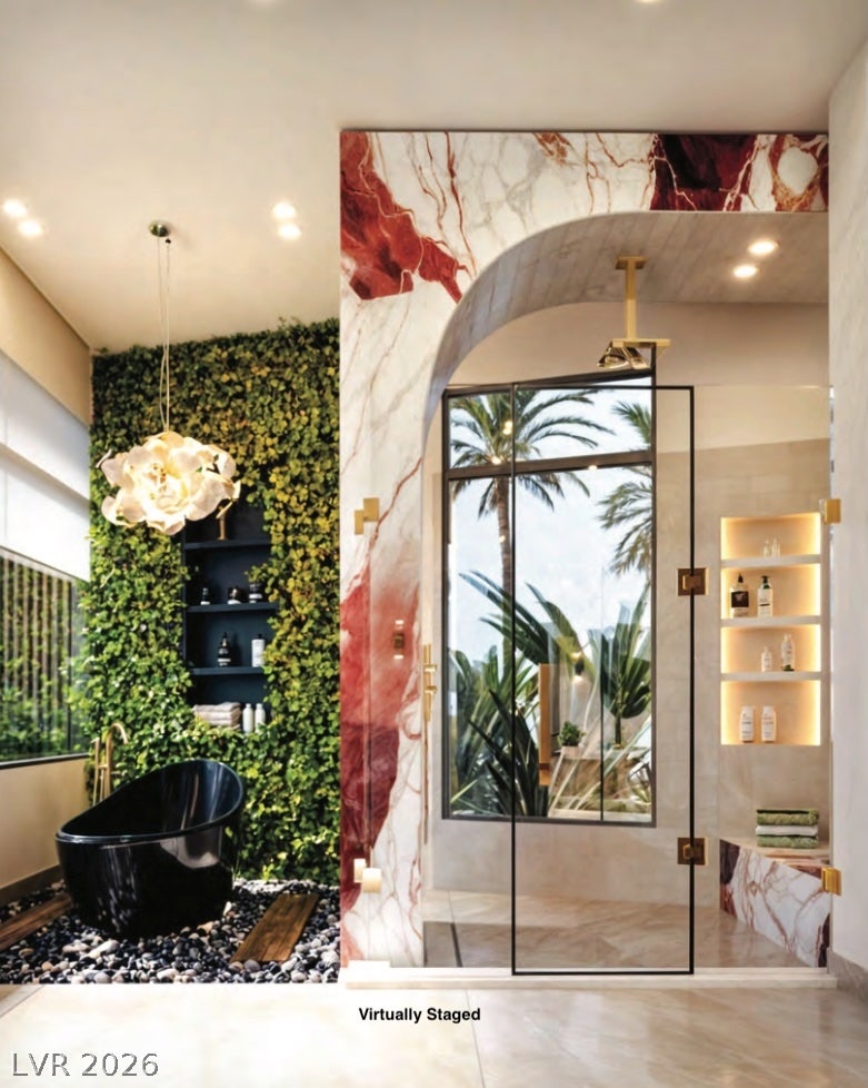 "Virtually Staged" Dramatic stone accents and high-end fixtures define this luxurious, spa-like bathing oasis.
