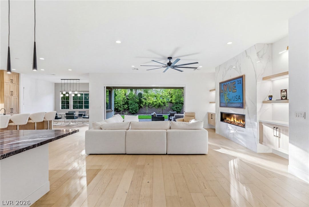 4078 San Franchesca Court, Las Vegas, NV 89141 A spacious, open-concept living area with abundant natural light, flowing seamlessly into a lush outdoor space.