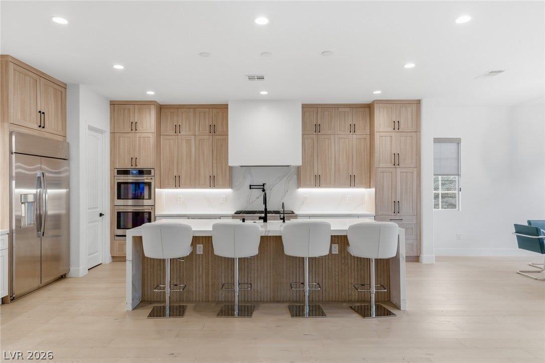 4078 San Franchesca Court, Las Vegas, NV 89141 Culinary excellence awaits in this well-appointed kitchen, featuring a spacious island and gleaming stainless steel appliances.