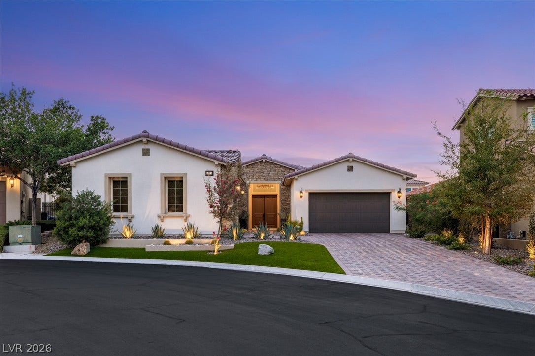 4078 San Franchesca Court, Las Vegas, NV 89141 An inviting exterior with a paver driveway, lush landscaping, and captivating entryway under a twilight sky.