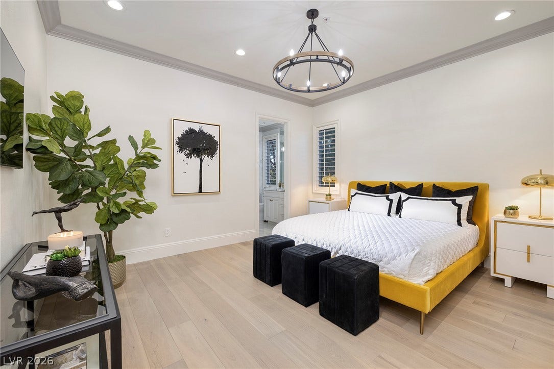 4 Ayden Drive, Henderson, NV 89052 Elegant crown molding and light wood floors define this tranquil sleeping space.