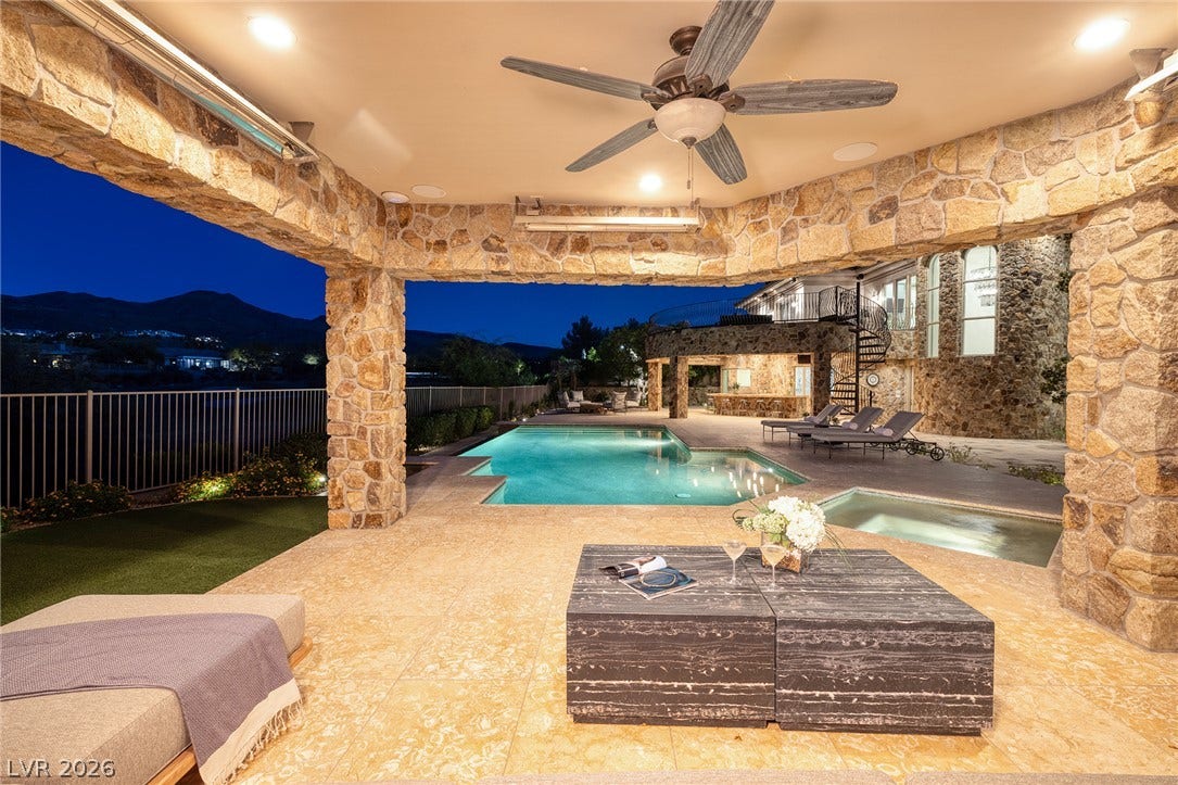4 Ayden Drive, Henderson, NV 89052 Stately stone pillars frame an inviting poolside patio under a spacious sheltered terrace.