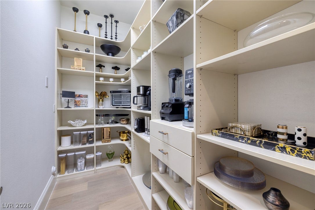 4 Ayden Drive, Henderson, NV 89052 Floor-to-ceiling custom shelving maximizing storage potential in this walk-in pantry.