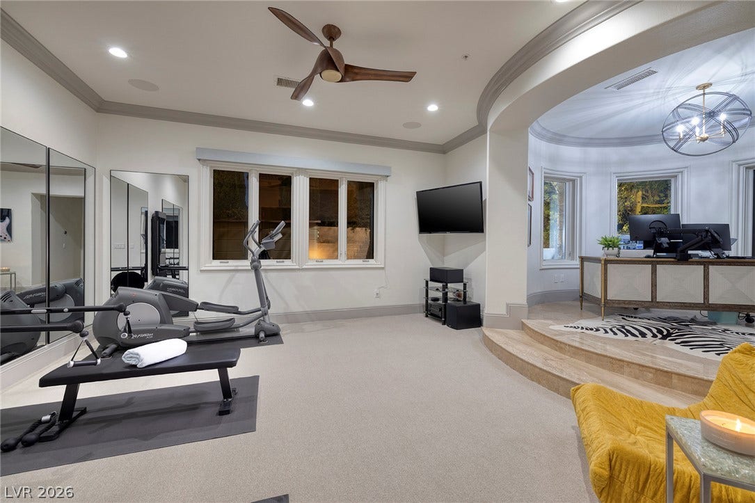 4 Ayden Drive, Henderson, NV 89052 An open layout features plush carpeting, crown molding, and an elevated office alcove.