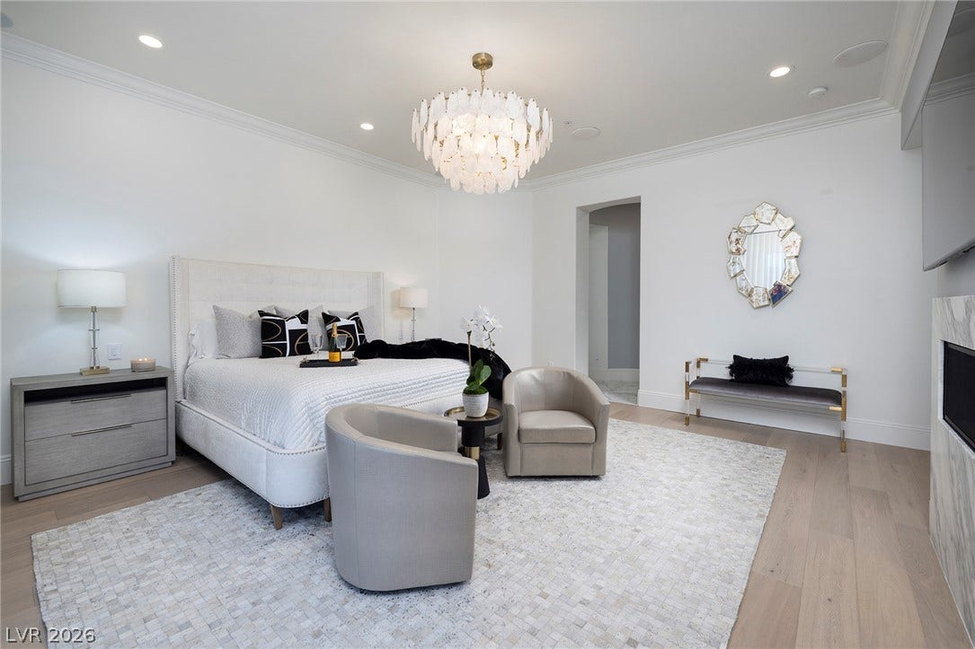4 Ayden Drive, Henderson, NV 89052 Elegant crown molding and warm wood flooring define this serene private sanctuary.