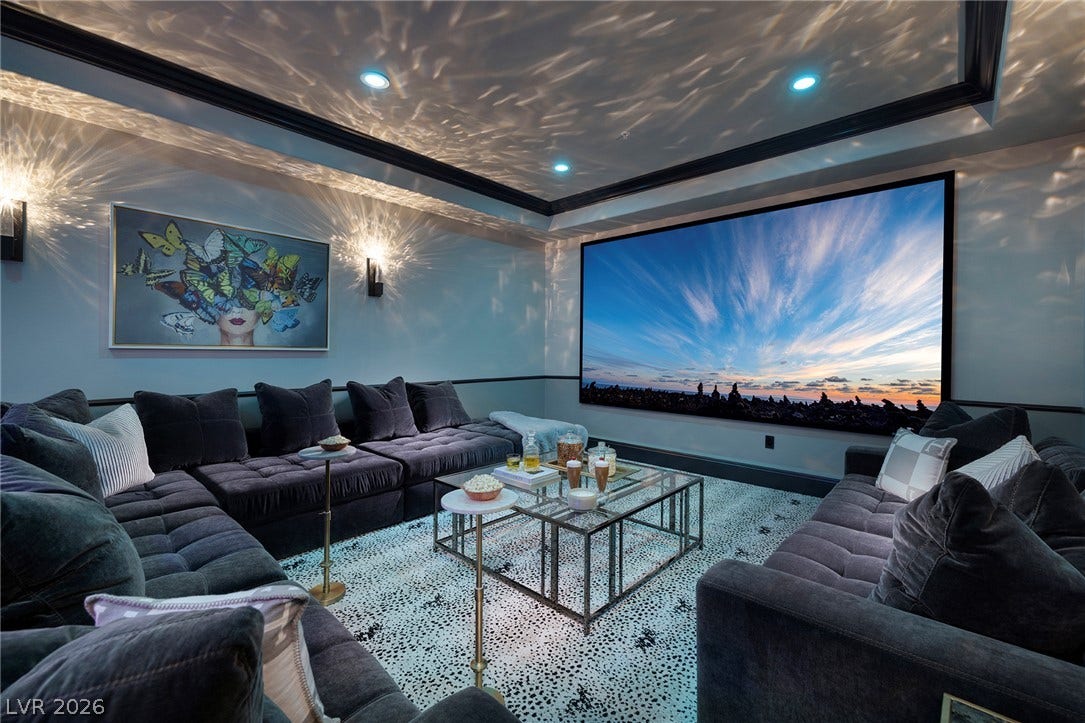 4 Ayden Drive, Henderson, NV 89052 Custom crown molding and a tray ceiling frame this spectacular private media space.